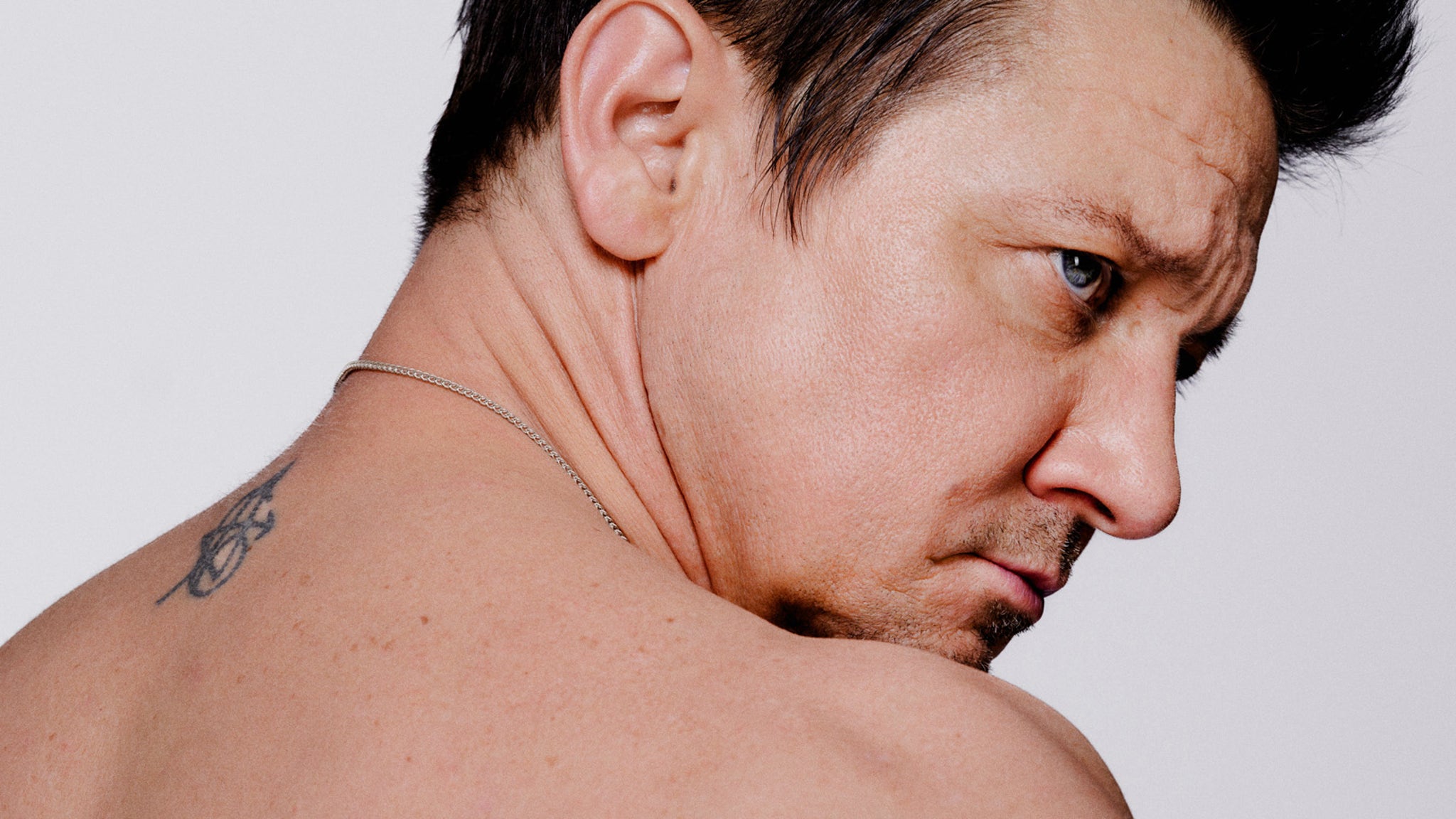 Jeremy Renner Poses Shirtless, Shows Scars From Snow Plow Accident [Video]