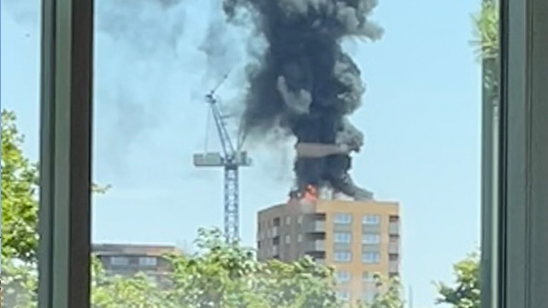 Staines fire updates: Tower block erupts into flames with plume of black smoke seen for miles  The Irish Sun [Video]