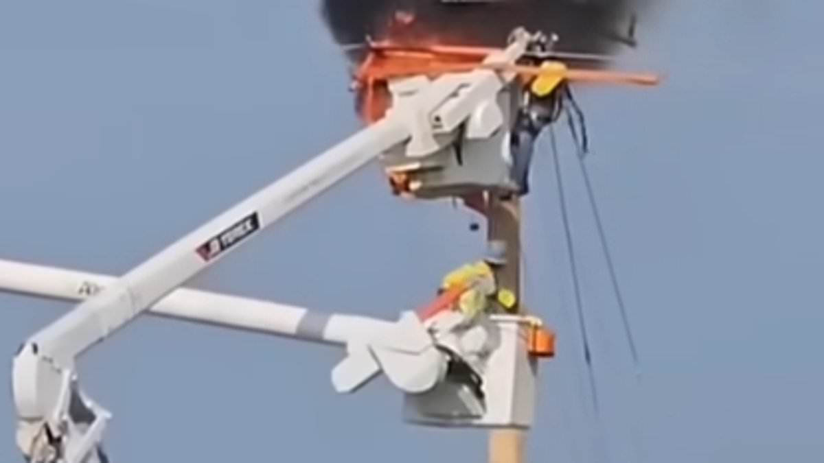 Heart-stopping moment utility worker desperately tries to save colleague as he clings to burning cherry picker [Video]