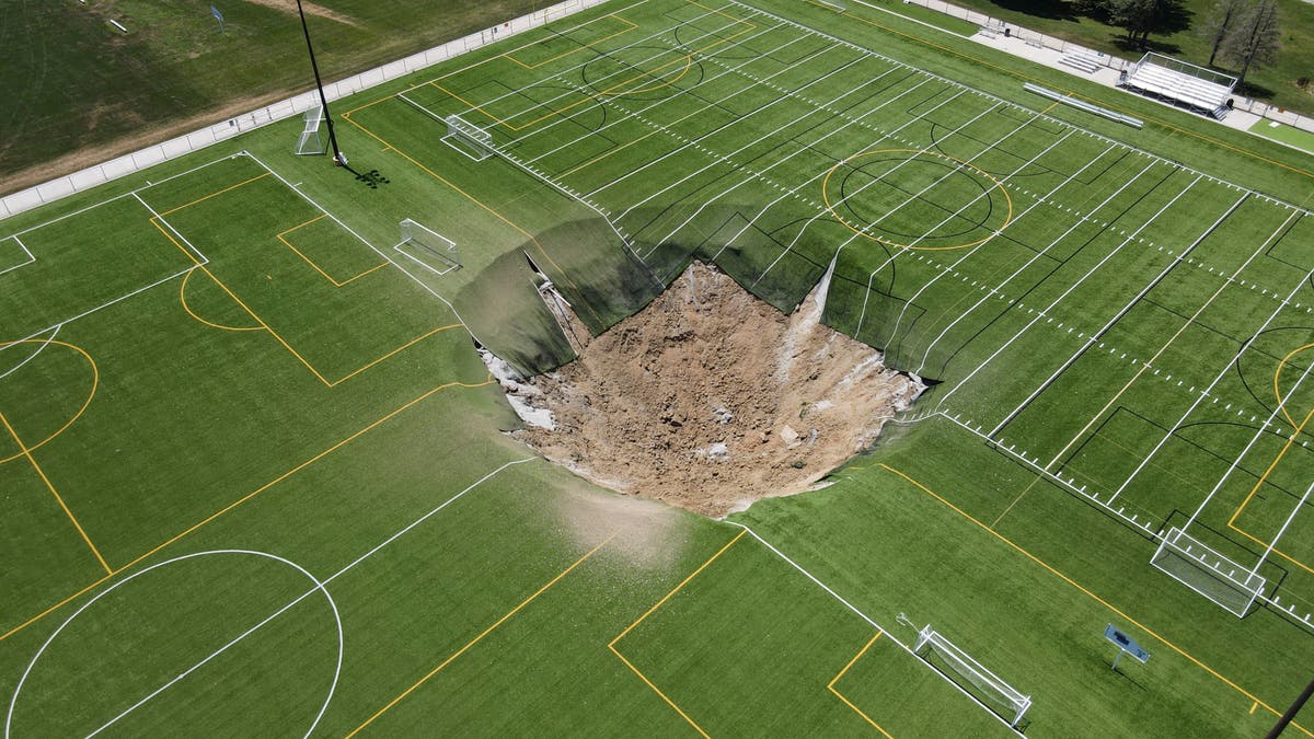 Giant sinkhole swallows middle of Illinois football field [Video]